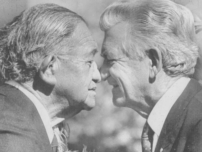 Bob Hawke exchanges a traditional greeting with New Zealand Parliament House chief Sir Ralph Love. Picture: Thomson