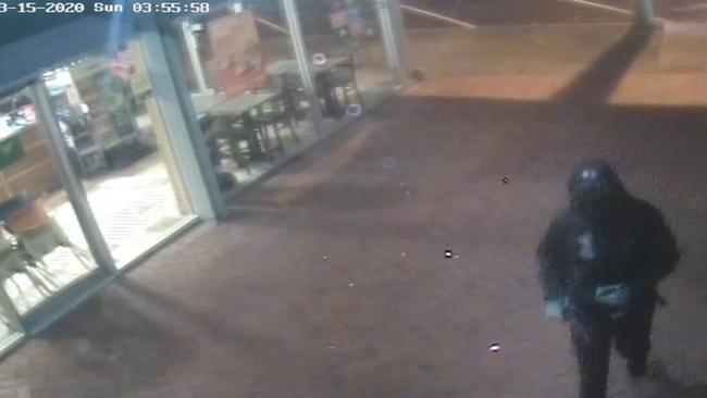 Footage of a suspect walking up a laneway shortly before entry was gained to Table 1 Espresso at Warners Bay about 3.55am on March 15. Picture: supplied