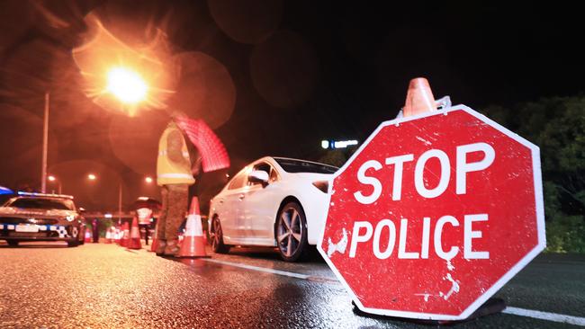 1am August 8 2020, Gold Coast Highway Coolanagatta Queensland – Queensland Police Officers with the assistance of The Australian Army stop all traffic into Queensland for checks at 1am on QLD/NSW border crossing due to increased lockdown of the State of Queensland Scott Powick Newscorp