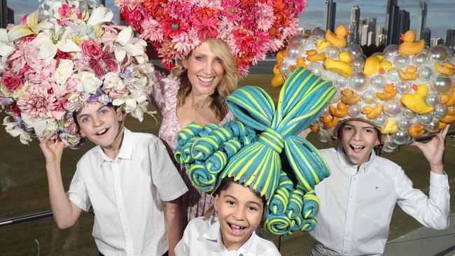 The three young male stars of the upcoming Priscilla Queen of the Desert musical at The Star Gold Coast, (from left) Ethan Dahl 11, John Scanlan, 9, and Diesel Bateson 11, pictured at Southport with co-star Emily Jade O'Keeffe, who plays Benji's mother. Picture Glenn Hampson