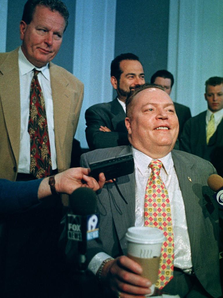 Hustler Magazine publisher Larry Flynt laughs with reporters after one of his legal battles. Picture: AP Photo/Tom Uhlman