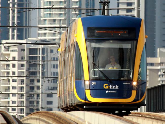 Gold Coast tram on the Southport Bridge . (sorry cloudy morning no sun ) . Picture Mike Batterham