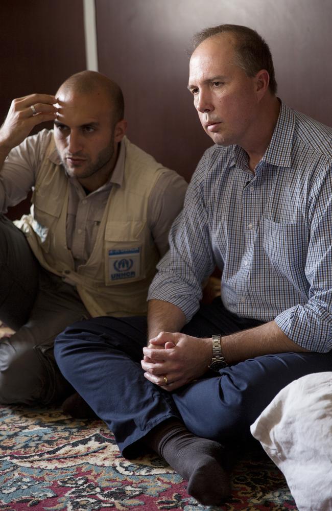 Eye opener ... Peter Dutton visits a family inside the Za’atari camp with the manager Hovig Etyemezian. Picture: Ella Pellegrini
