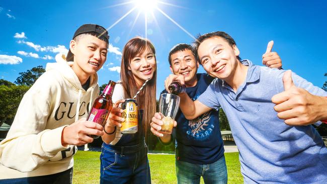 Chinese tourists Lin Kung Chen, Linge Chen, Judy Wu and Chungyi Wu sinking XXXX Golds and Bundaberg Rum during their trip to the Gold Coast. Picture: Nigel Hallett