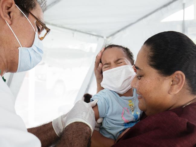 Three-year-old Sanele receives her MMR vaccination at Poutasi District Hospital from Nurse Unit Manager James Belford. Picture: Infinity Images Fiji