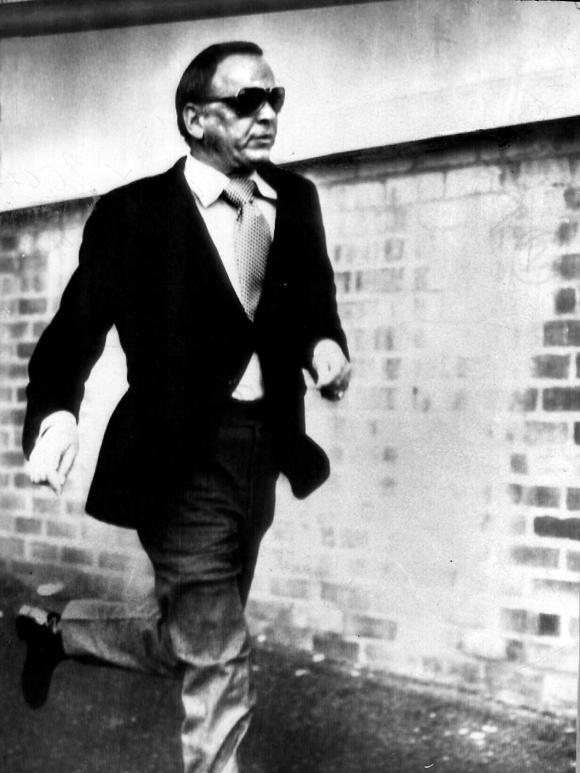 Frank Sinatra fleeing from journalists outside Festival Hall in 1974.