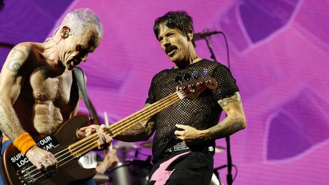 Red Hot Chili Peppers co-founders Flea and Anthony Kiedis on stage in Sydney on Thursday night. Picture: Jonathan Ng / The Daily Telegraph