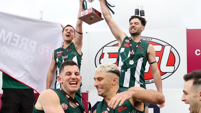 Airport West players celebrate after winning the grand final. Picture: George Salpigtidis