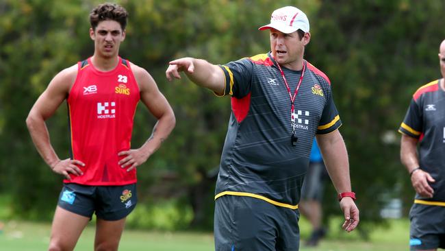 New Gold Coast Suns coach Stuart Dew takes training.