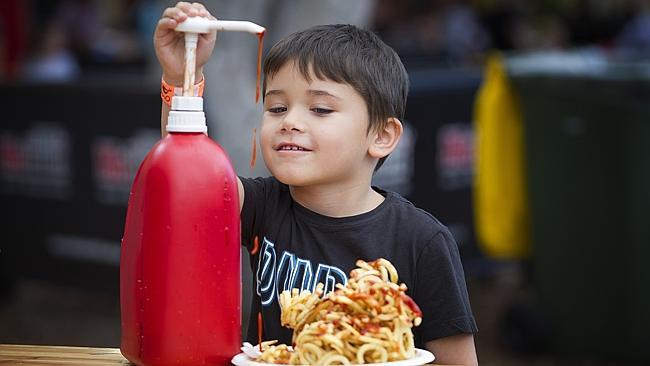 Alex Banton, 5, of Blacktown, prepares to tuck in to his ribbon fries. Only 1399.9kg to go, Alex! Picture: Melvyn Knipe