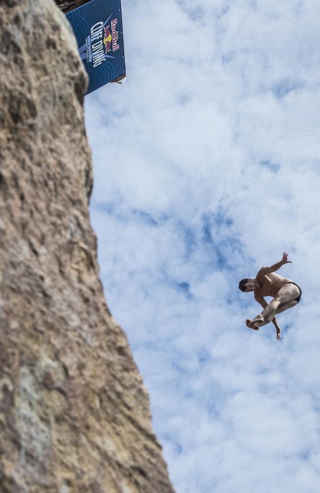 Steven LoBue of the USA diving from the 28 metre platform during the eighth stop of the Red Bull Cliff Diving World Series at Shirahama, Japan. Picture: AFP PHOTO / RED BULL / Jason HALAYKO