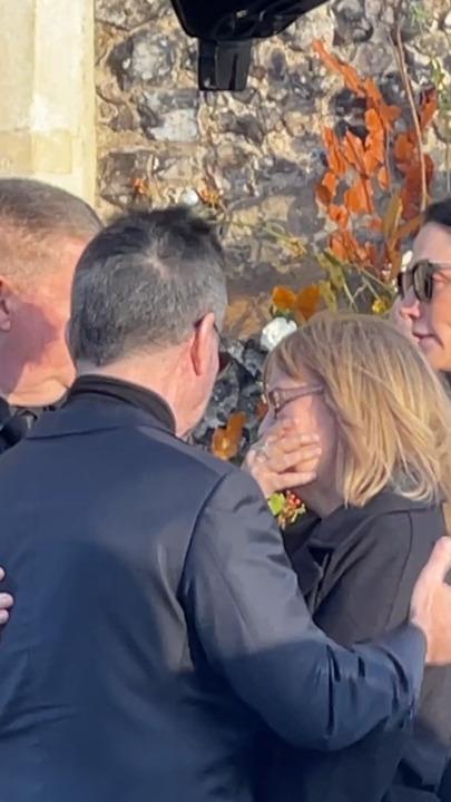 Simon Cowell comforts Liam Payne's parents at funeral