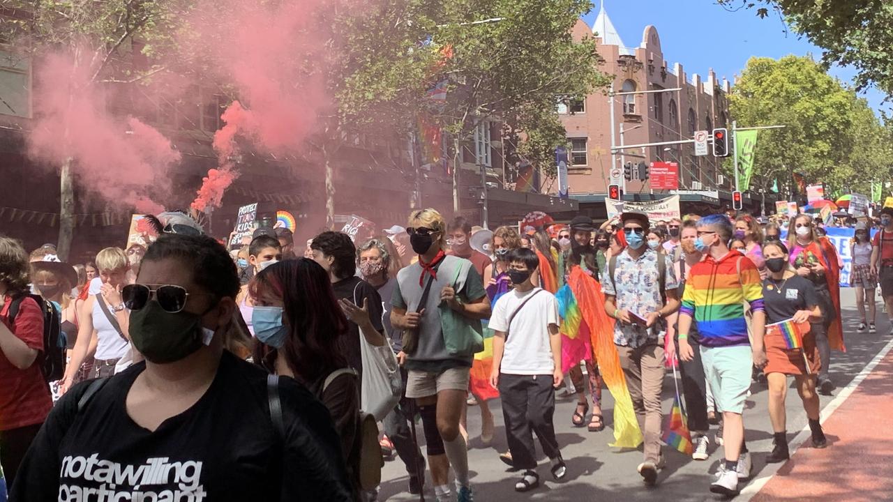 Marching to Madonna and letting off pink smoke, the protesters walked down Oxford Street. Picture: Benedict Brook/news.com.au