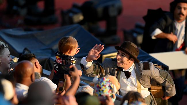 A performer interacts with young spectator.