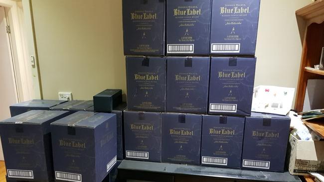 NSW Police and ABF officers seized 16kg of heroin and $30,000 worth of Blue Label Johnnie Walker which was allegedly trafficked into Sydney last week.