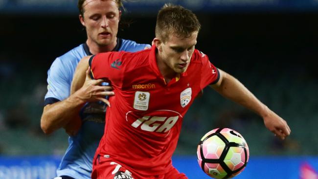 In control ... Ryan Kitto takes on Sydney FC’s Rhyan Grant at Allianz Stadium. Picture: Matt King (Getty Images)