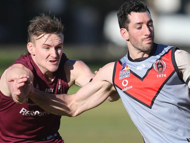 Division one Adelaide Footy League match between Prince Alfred Old Collegians and Rostrevor Old Collegians. RostrevorÃs Luke Manuel gets a kick under pressure from PAC opponent.  3 July 2021. Picture Dean Martin