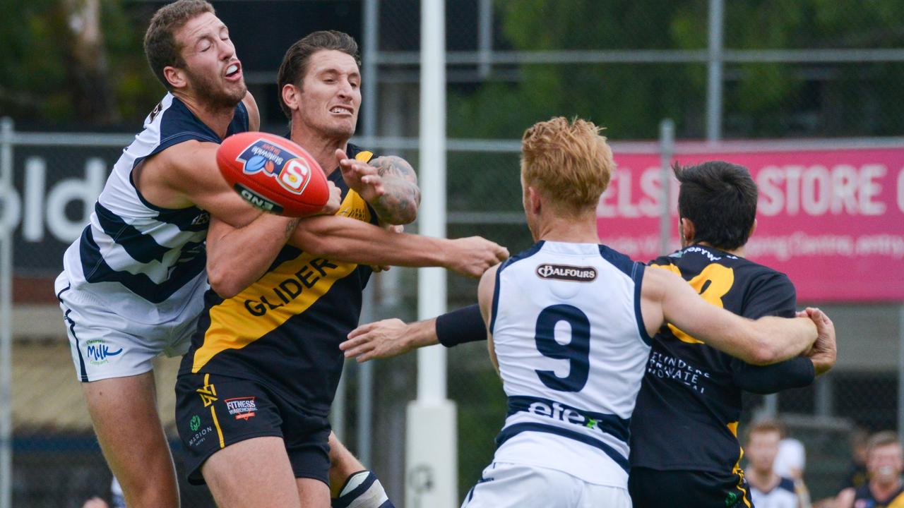 SANFL: Glenelg v South Adelaide at Glenelg Oval, Saturday, April 13, 2019. Michael Knoll spoils Glenelg's Jesse White. (AAP Image/Brenton Edwards),