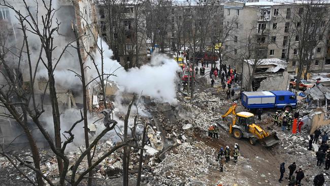 Ukrainian rescue workers clear debris at the site of a missile attack in Kharkiv amid the Russian invasion of Ukraine. Picture: AFP