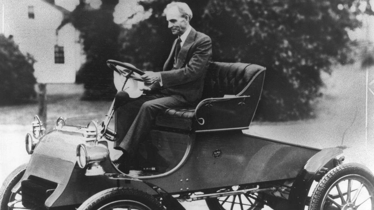 USA car manufacturer industrialist Henry Ford driving his first production vehicle, the 1903 model A Ford Runabout. historical automobile motor 1900s /Automobiles/Ford