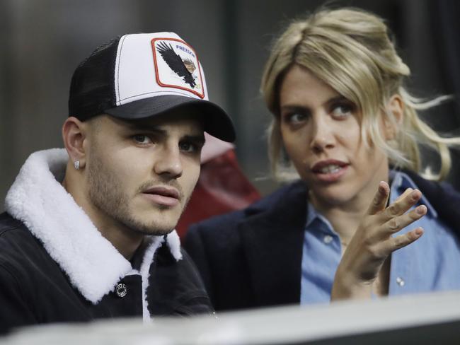 Inter Milan's Mauro Icardi is flanked by his wife Wanda Nara during the Europa League, round of 32, second leg soccer match between Inter Milan and SK Rapid Vienna, at the San Siro stadium in Milan, Italy, Thursday, Feb. 21, 2019. (AP Photo/Luca Bruno)