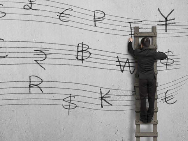 Drawing money symbol stave on concrete wall. Photo: iStock