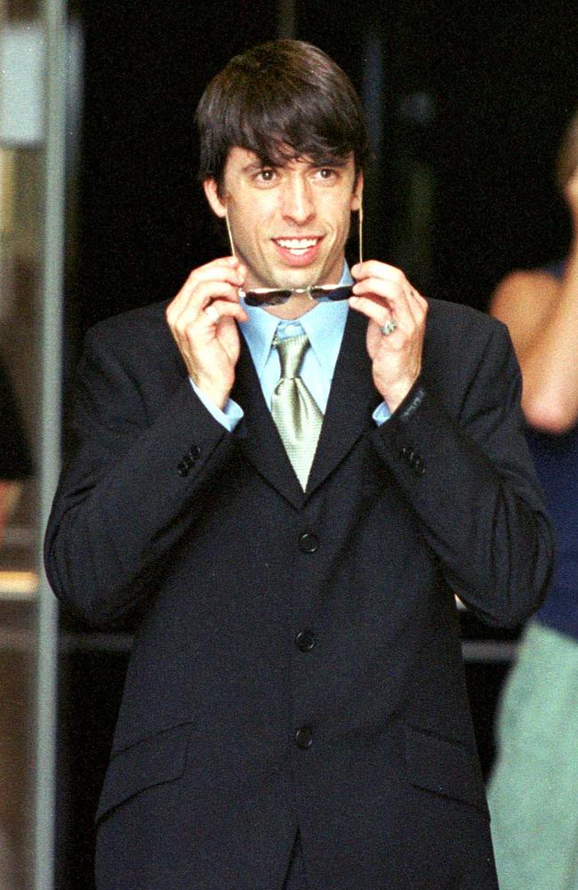 What do you call a rock star wearing a suit? Grohl outside Southport Local Court in 2000. Picture: NCA