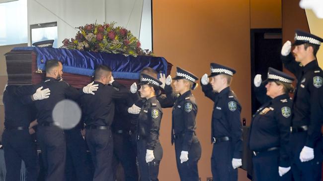 … while police officers formed a guard of honour. Picture: NCA NewsWire / Roy VanDerVegt