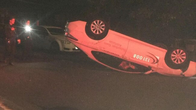 A taxi driver has lost his licence after his car flipped onto its roof at Broadview., Police say the Toyota sedan crashed into parked vehicles before it became airborne and rolled., A 25-year-old driver has been reported for failing to comply with a breath test, failing to truly answer questions and driving without due care.  Picture: 7NEWS