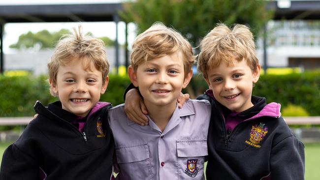 Archer and River Cook with their older brother Finn at Haileybury’s Newlands Campus. Image: supplied.