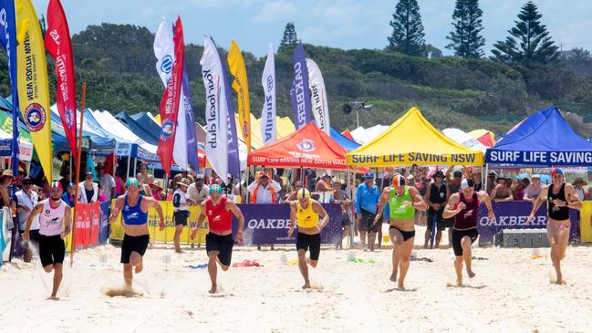 Competitors in a beach sprint at the 2023 NSW Surf Life Saving Country Championships at One Mile Beach, Forster. Photo: Shane Abrahamson/SLS NSW.