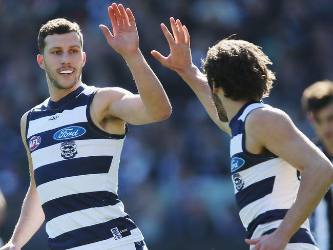 MELBOURNE, AUSTRALIA - AUGUST 19:  James Parsons of the Cats celebrates a goal with Sam Menegola (L) during the round 22 AFL match between the Collingwood Magpies and the Geelong Cats at Melbourne Cricket Ground on August 19, 2017 in Melbourne, Australia.  (Photo by Michael Dodge/Getty Images)