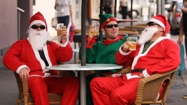 Dave Evans, Ashley Grinham and Todd Rowland get into the Christmas spirit with a few early beers at the Marble Bar in Waymouth Street in December 2008.