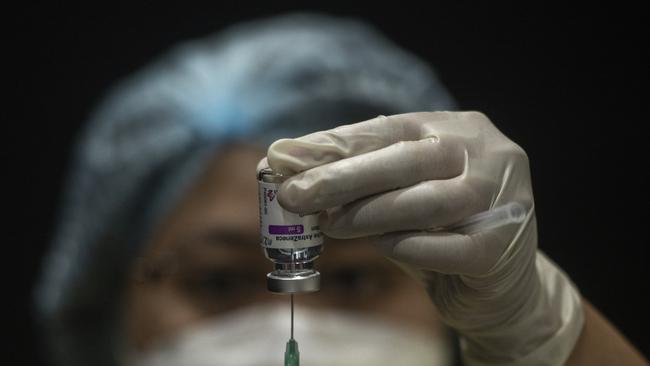 A health workers prepares a syringe for administering the AstraZeneca Covid-19 coronavirus vaccine. Picture: Getty Images.