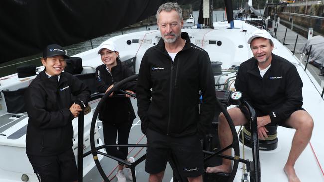 LawConnect owner and skipper Christian Beck with staff members Wenee Yap, left, Ellen Howard and Paul Kimber at Woolwich dock in Sydney. Picture: John Feder