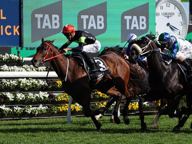 Australian sprinter Think About It, ridden by Sam Clipperton (L), crosses the line first in the world's richest turf race, The Everest, in Sydney on October 14, 2023. The Joe Pride-trained five-year-old stormed through the field in the final 100 metres at Royal Randwick to collect a whopping Aus$7.0 million (US$4.4 million) for barely a one-minute dash. (Photo by DAVID GRAY / AFP)