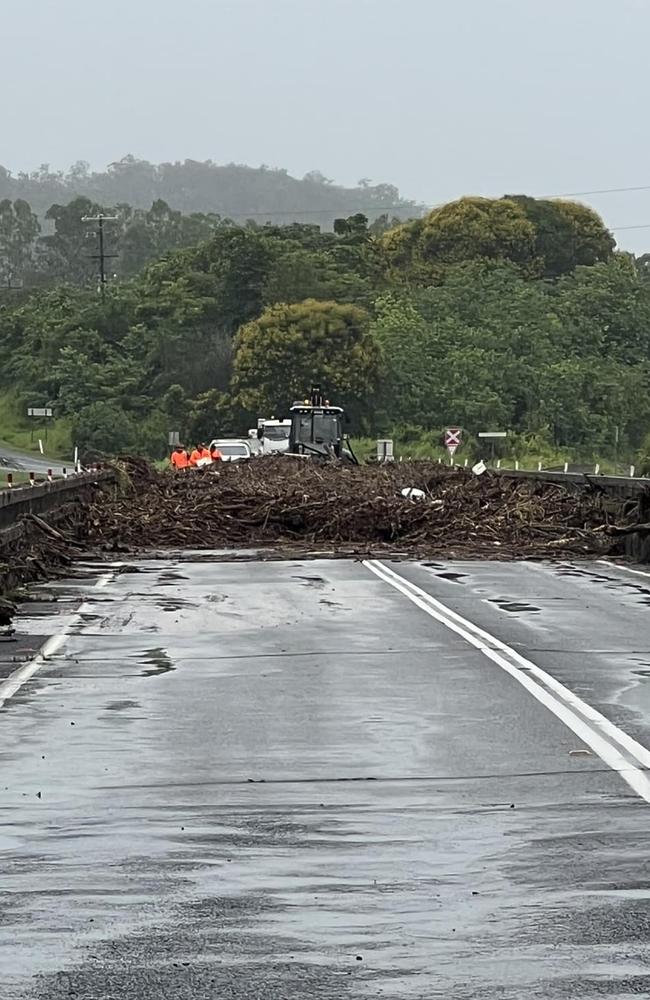 Facebook user Scott Davidson shared this photo of council workers cleaning up Gargett Bridge after it went underwater. Photo: Contributed