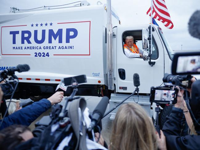 GREEN BAY, WISCONSIN - OCTOBER 30: Republican presidential nominee, former President Donald Trump holds a press conference from inside trash hauler at Green Bay Austin Straubel International Airport on October 30, 2024 in Green Bay, Wisconsin. With less than a week until Election Day, Trump is campaigning for re-election in the battleground states of North Carolina and Wisconsin.   Chip Somodevilla/Getty Images/AFP (Photo by CHIP SOMODEVILLA / GETTY IMAGES NORTH AMERICA / Getty Images via AFP)