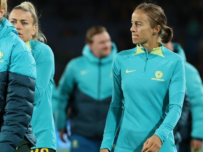 SYDNEY, AUSTRALIA - AUGUST 16: Clare Polkinghorne and Aivi Luik of Australia look dejected after the team's 1-3 defeat and elimination from the tournament following the FIFA Women's World Cup Australia & New Zealand 2023 Semi Final match between Australia and England at Stadium Australia on August 16, 2023 in Sydney, Australia. (Photo by Cameron Spencer/Getty Images)