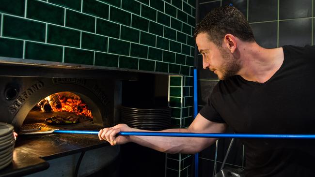 Maurizio Ressa at the wood-fired oven.