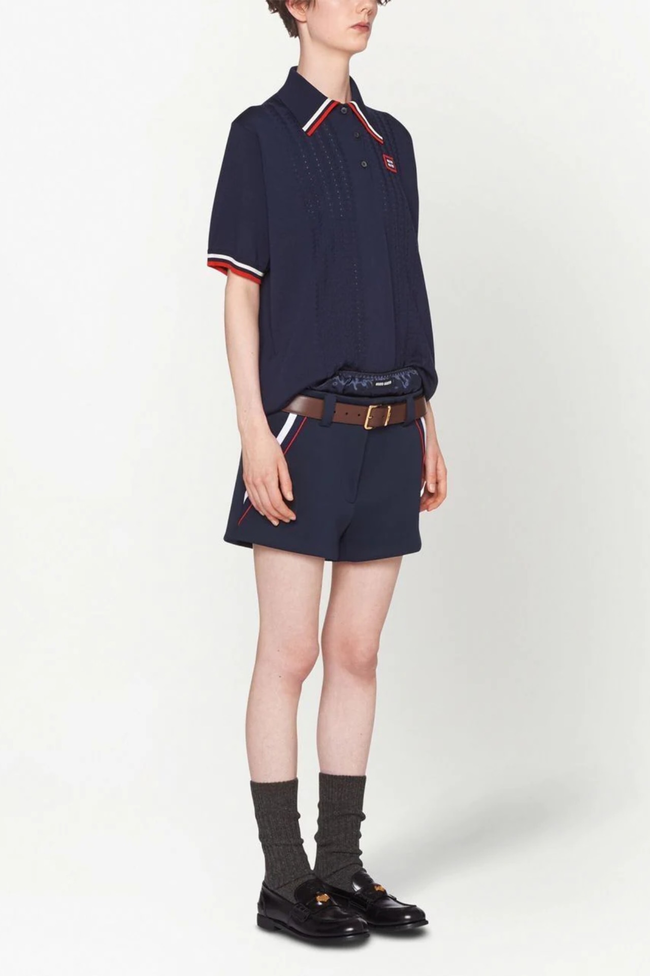 <p><b>SHOP NOW: </b>Miu Miu logo-patch short-sleeve polo shirt, $2,320 from <a href="https://www.farfetch.com/au/shopping/women/miu-miu-logo-patch-short-sleeve-polo-shirt-item-19271886.aspx" target="_blank" rel="nofollow noopener"><b>Farfetch</b></a></p><h2><b>The accessories</b></h2>