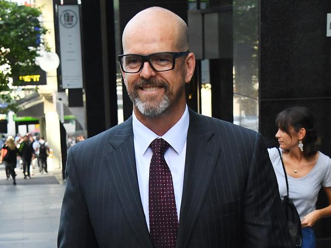 Former Victoria Police Chief Commissioner Simon Overland departs the Royal Commission into the Management of Police Informants at the Fair Work Commission in Melbourne, Tuesday, January 21, 2020. (AAP Image/James Ross) NO ARCHIVING