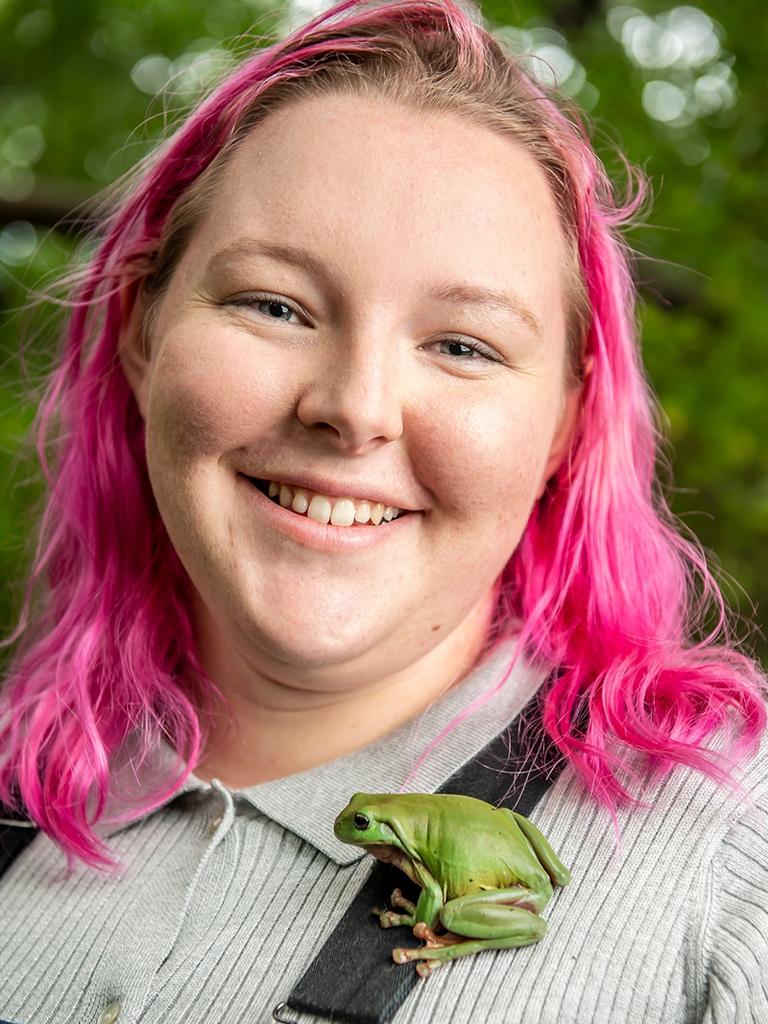 University of Southern Queensland honours student Mickayla Heinemann gets up close and personal with her research subject, a green tree frog. Picture: USQ Photography