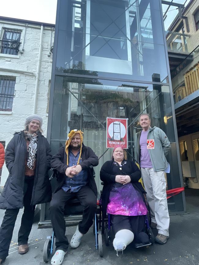 From left, protest organiser Kate Kelly, disability advocate Ana Pike, artist Jon Kudelka and Disability Voices Tasmania director Michael Smalls at the ribbon un-cutting ceremony for the Salamanca Arts Centre lift.