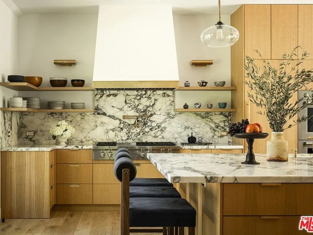 Marble and brass feature throughout the kitchen. Picture: Realtor.com