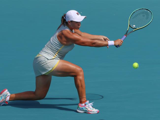 MIAMI GARDENS, FLORIDA - MARCH 27: Ashleigh Barty of Australia returns a shot during her women's singles third round match against Jelena Ostapenko of Latvia on Day 6 of the 2021 Miami Open presented by ItaÃº at Hard Rock Stadium at Hard Rock Stadium on March 27, 2021 in Miami Gardens, Florida.   Mark Brown/Getty Images/AFP == FOR NEWSPAPERS, INTERNET, TELCOS & TELEVISION USE ONLY ==