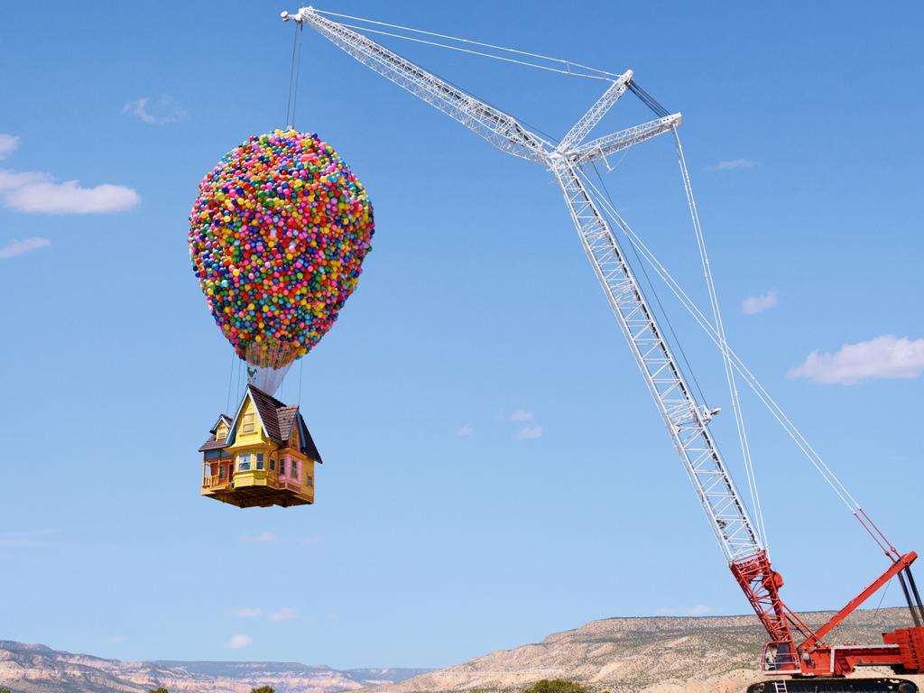 The Up house is held in the air by a giant crane.