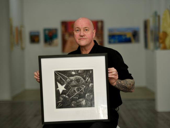 Townsville artist, tattooer and Veteran Rob Douma has been awarded the annual Umbrella Members Prize for a reflective self-portrait depicting his time on deployment in East Timor. Picture: Evan Morgan
