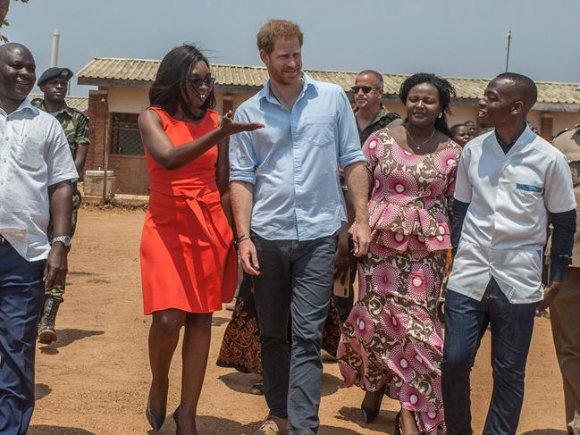 Prince Harry greets staff and officials at the Mauwa Health Centre in Chiradzulu District, southern Malawi. Picture: AFP