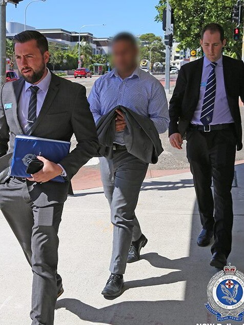 An alleged ‘peeping Tom’ (centre) has been arrested and charged. Picture: NSW Police.